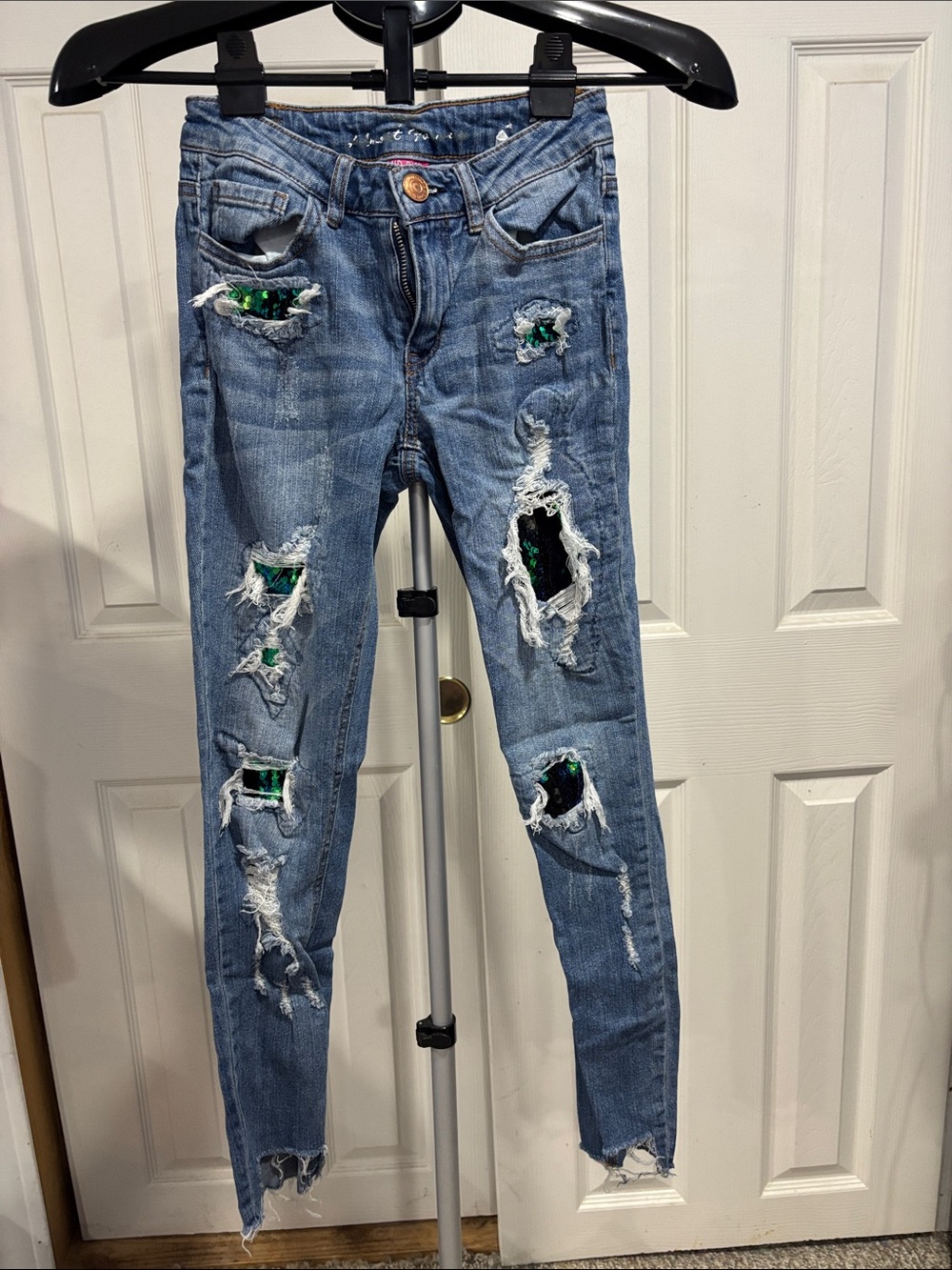 Almost Famous Skinny Jeans with Green/Black Switching Sequin Peekaboo Details